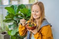 Woman eating Raw Organic Poke Bowl with Rice and Veggies close-up on the table. Top view from above horizontal Royalty Free Stock Photo