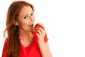 Woman eating red apple isolated over white backgoround Royalty Free Stock Photo