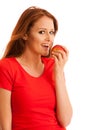 Woman eating red apple isolated over white backgoround Royalty Free Stock Photo