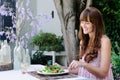 Woman eating salad, alfresco dining Royalty Free Stock Photo