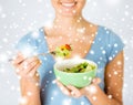 Woman eating salad with vegetables Royalty Free Stock Photo