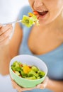 Woman eating salad with vegetables Royalty Free Stock Photo