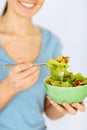 Woman eating salad with vegetables Royalty Free Stock Photo
