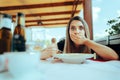 Woman Eating Soup in a Restaurant Feeling Sick Royalty Free Stock Photo