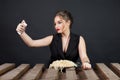 Woman eating spaghetti and taking selfie Royalty Free Stock Photo