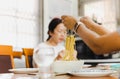 Woman eating spaghetti on white bowl with spoon and fork. Royalty Free Stock Photo