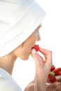 Woman eating strawberries Royalty Free Stock Photo