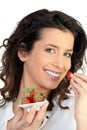 Woman eating strawberries Royalty Free Stock Photo