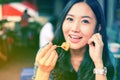 Woman eating Chinese steamed dumpling