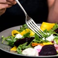 Woman Eating a Summer Salad off a Plate Royalty Free Stock Photo