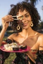 Woman eating sushi in the park Royalty Free Stock Photo