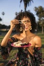 Woman eating sushi at the park Royalty Free Stock Photo