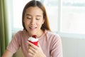 Woman eating sweet cupcake on diet cheat day. Royalty Free Stock Photo