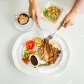 Woman eating T-bone steck Royalty Free Stock Photo