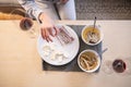 Woman eating tasty food during an intimate meal at home.Top view Royalty Free Stock Photo