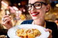 Woman eating tortellini pasta
