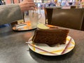 Woman eating traditional Sachertorte chocolate cake Royalty Free Stock Photo