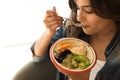 Woman eating a vegan bowl Royalty Free Stock Photo