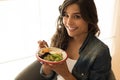 Woman eating a vegan bowl Royalty Free Stock Photo