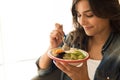 Woman eating a vegan bowl Royalty Free Stock Photo