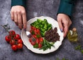 Woman eating vegan salad