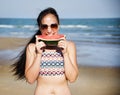 Woman eating watermelon on the beach Royalty Free Stock Photo