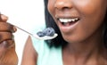 Woman eating a yogurt with blueberries Royalty Free Stock Photo