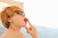 Woman eats berry Royalty Free Stock Photo