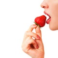 Woman eats berry, Royalty Free Stock Photo