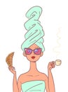 Woman eats breakfast with croissant and coffee. Business woman in the morning after a bath