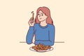 Woman eats french fries without thinking about health risks of fast food and fried snacks