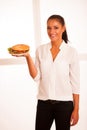 Woman eats hamburger over white background