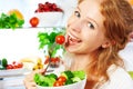 Woman eats healthy food vegetable vegetarian salad about refrige Royalty Free Stock Photo