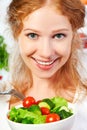 woman eats healthy food vegetable vegetarian salad about refrigerator Royalty Free Stock Photo