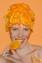 Woman eats orange