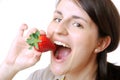 Woman eats a strawberry Royalty Free Stock Photo