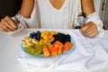 Woman Eatting Fresh Summer Fruits Salad. Royalty Free Stock Photo