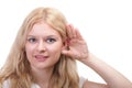 Woman eavesdropping with hand behind her ear