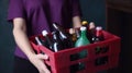 Woman Eco Activist hands holding box garbage ready for recycling, plastic and glass bottles, Zero waste lifestyle. Royalty Free Stock Photo