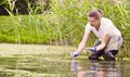 Woman ecologist getting sampels of the plants