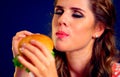 Woman edacity eat hamburger fast food