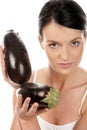 Woman with eggplants Royalty Free Stock Photo