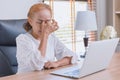 Woman elderly eyes pain from Asthenopia stress tired sinus suffer fatigue from hard work with computer screen Royalty Free Stock Photo