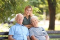 Woman with elderly parents in park Royalty Free Stock Photo
