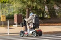 woman with an electirc wheelchair on the street Royalty Free Stock Photo