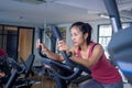 Woman electric bicycles in at fitness gym, Young woman workout in gym healthy lifestyle