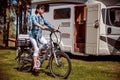Woman on electric bike resting at the campsite Royalty Free Stock Photo
