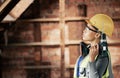 Woman, electric drill and engineer construction worker in building for wall renovation. Industry professional contractor Royalty Free Stock Photo