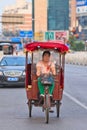 Woman on electric motorized rickshaw, Beijing, China