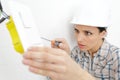 woman electrician installing electrical socket Royalty Free Stock Photo